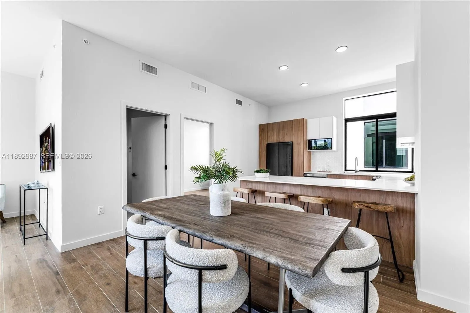 OPEN FLOOR PLAN CAN BE SET UP IN MULTIPLE WAYS. BREAKFAST BAR KITCHEN.