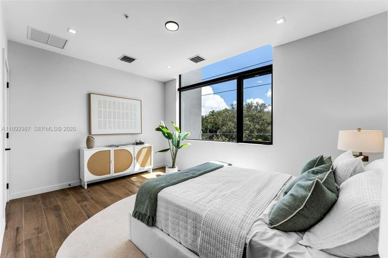 PRIMARY WITH PICTURESQUE CUT-OUT WINDOWS, DOUDLE SINKS, WALK IN CLOSETS.