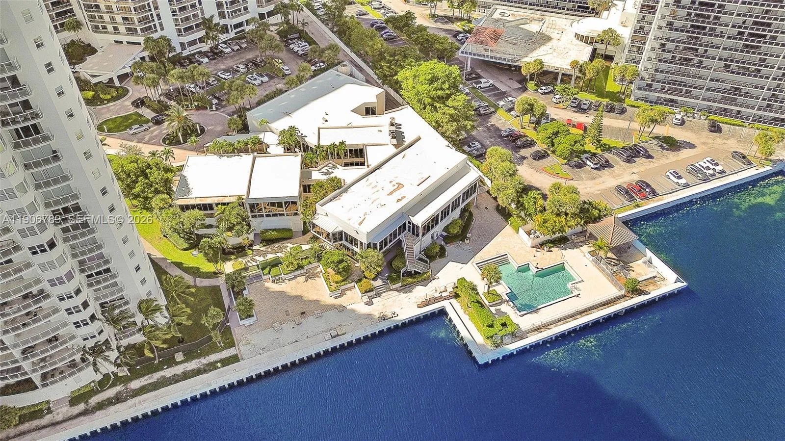 Private on-site spa, separate fitness center, pool, tennis, and resident restaurant — resort lifestyle without leaving the building.