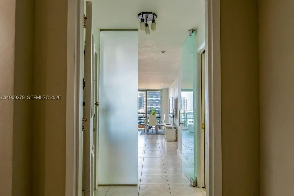Glass Door after entrance door to enter Living room