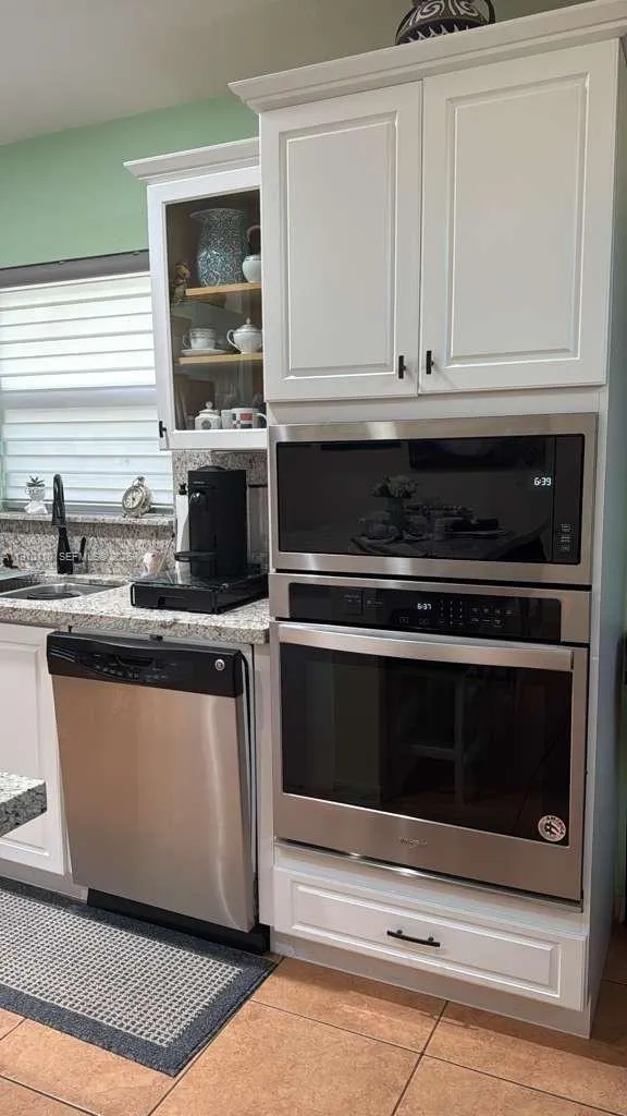 Microware and oven in separate cabinet