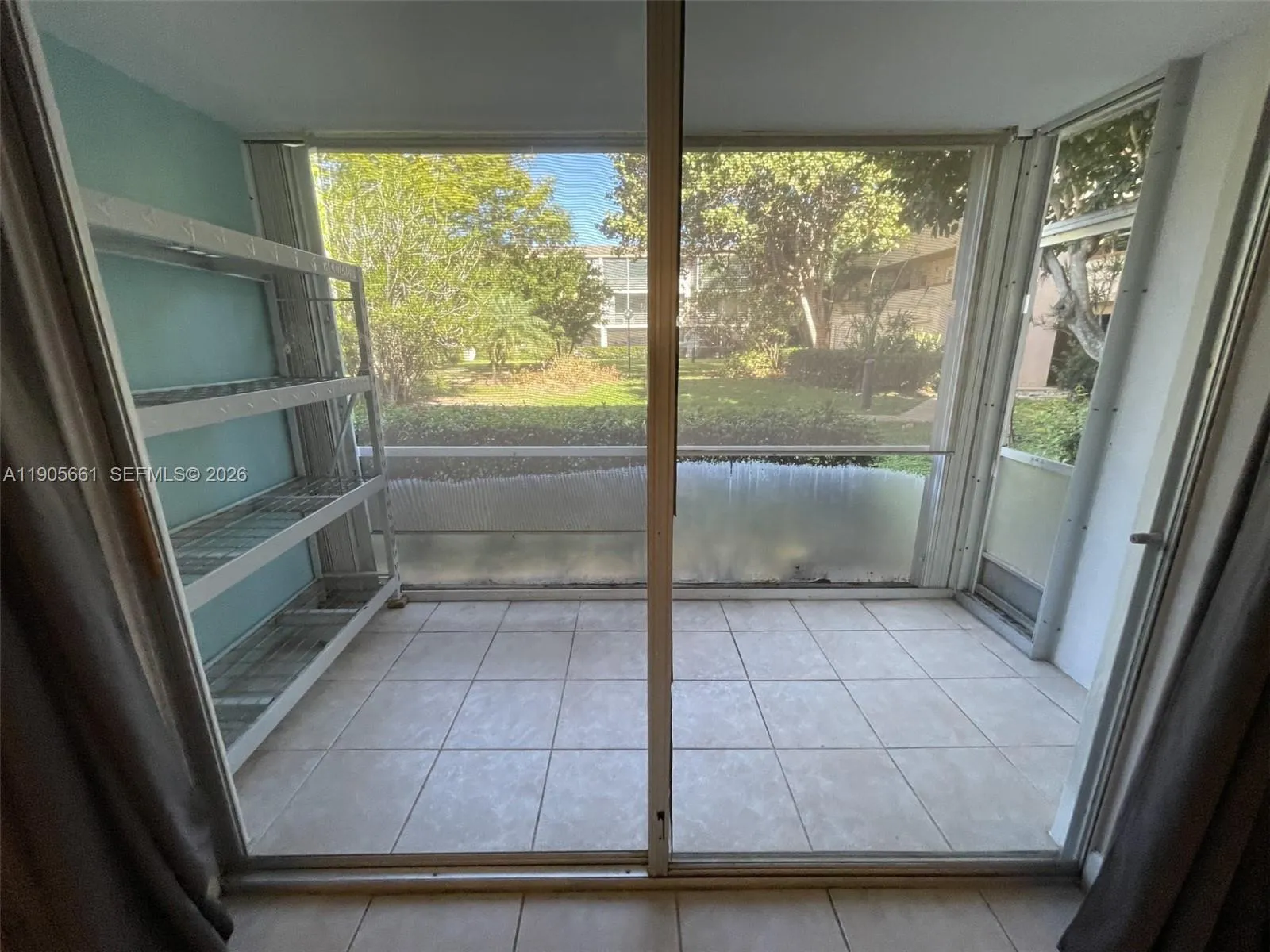 Screened Patio with Accordion Hurricane Shutters