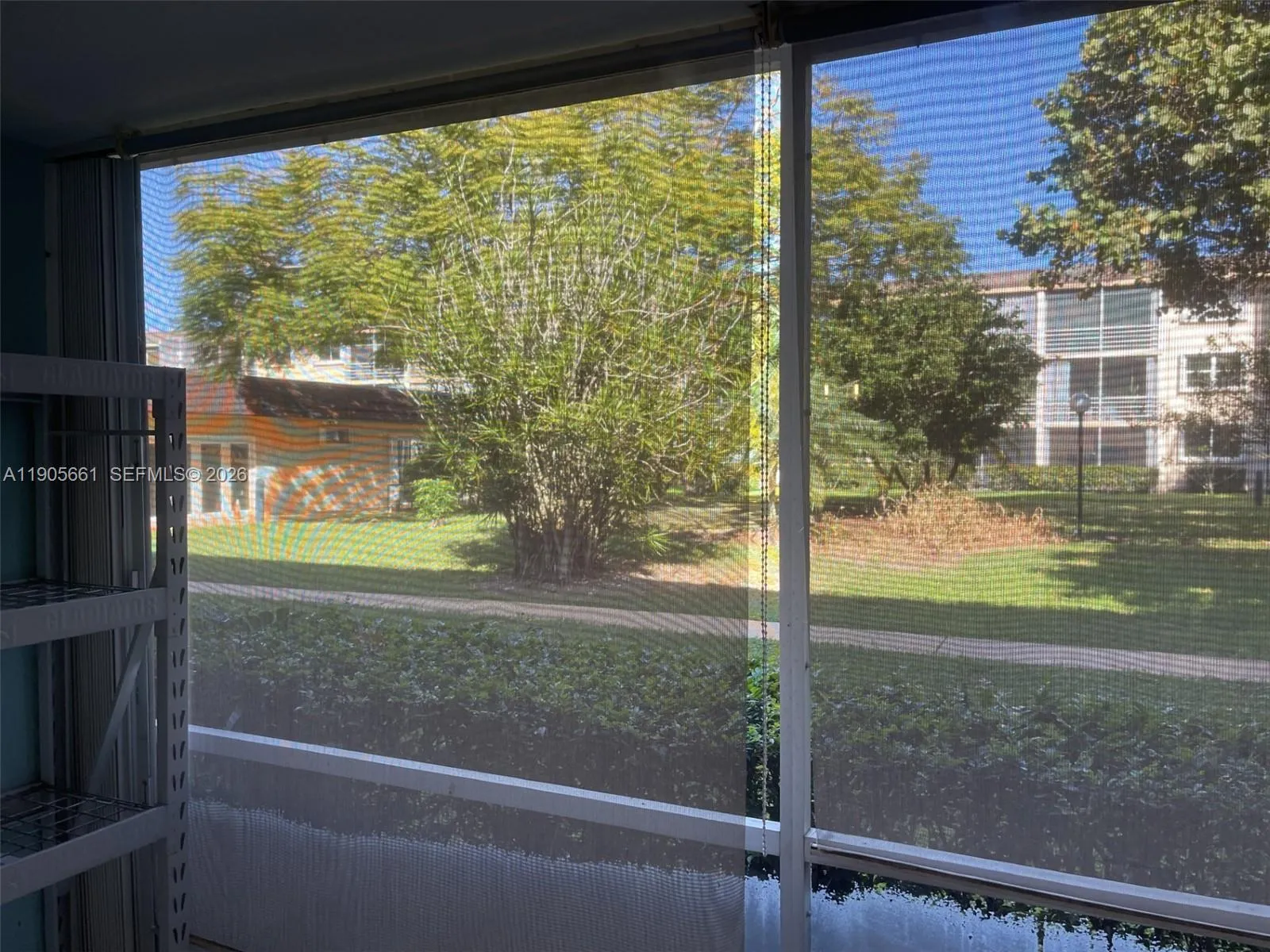 Screened Patio with Accordion Hurricane Shutters