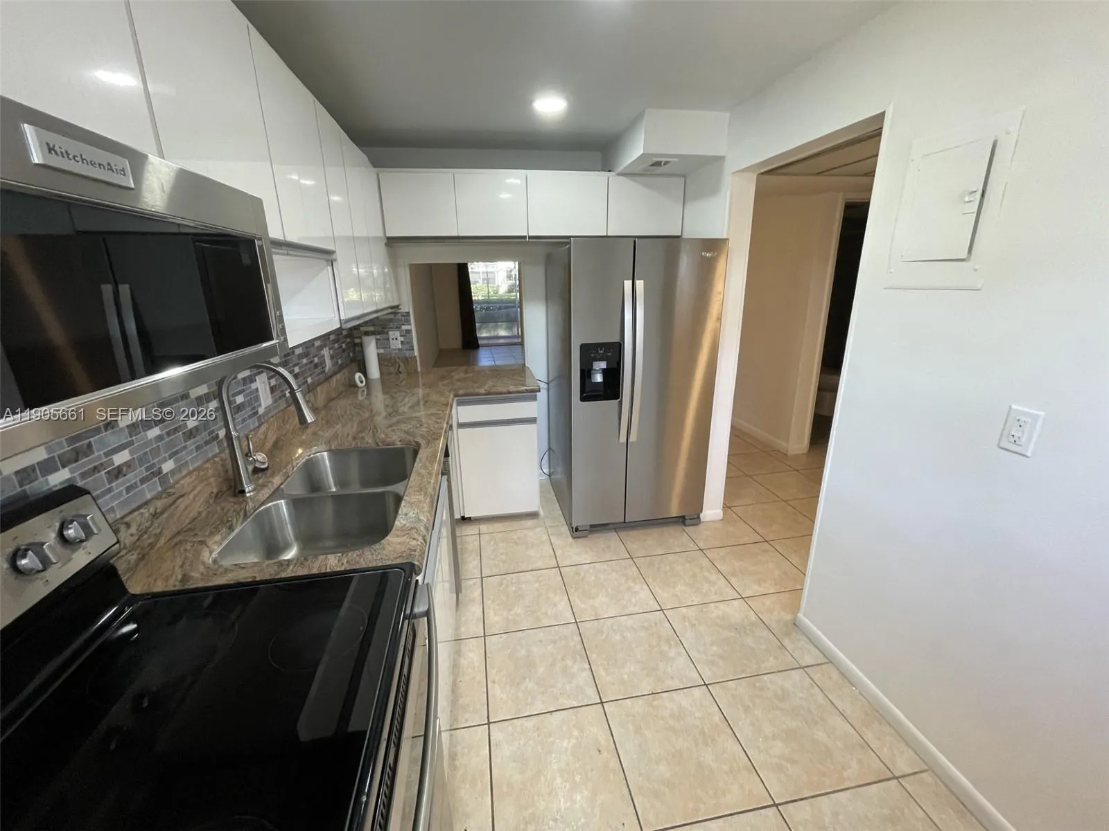 Kitchen with New Stainless Steel Appliances and Recessed Ceiling Lights