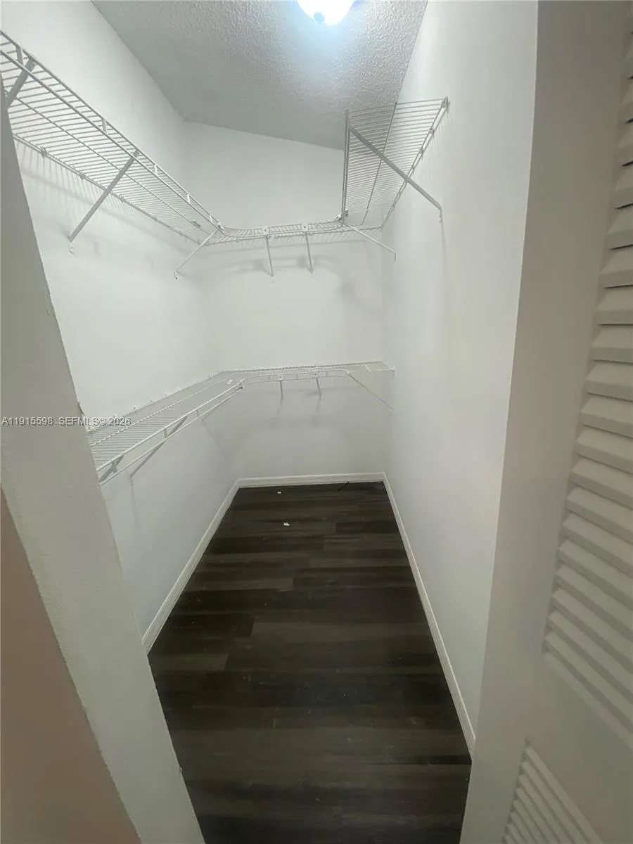Primary Bedroom walk-in closet