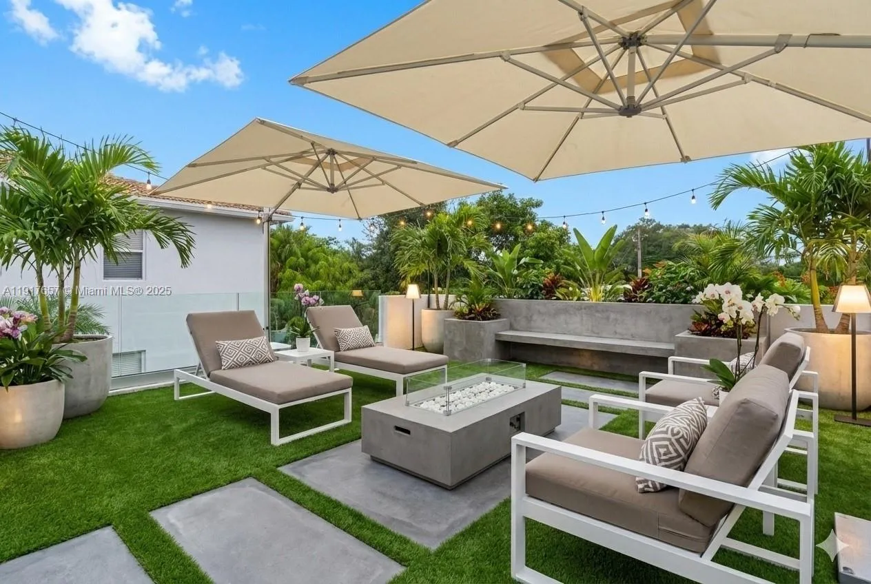 Virtually staged roof patio are above 5820 NW 3rd Ave
