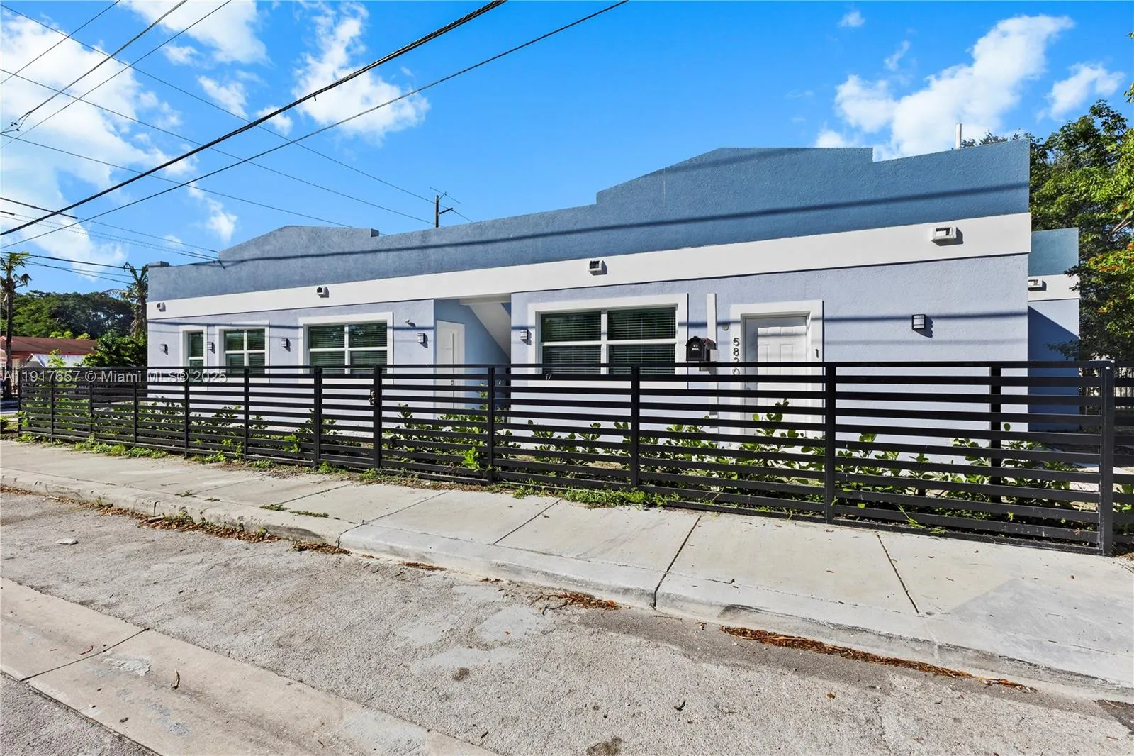 Duplex with both units and sep folios at 305 NW 58 St & 5820 NW 3rd Ave
