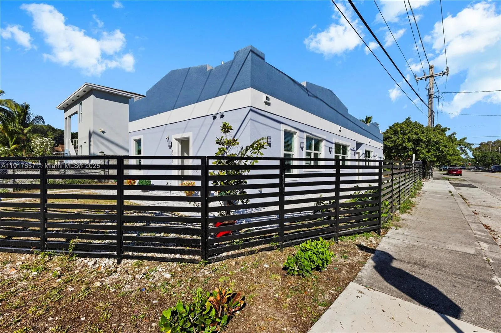 Duplex with both units and sep folios at 305 NW 58 St & 5820 NW 3rd Ave