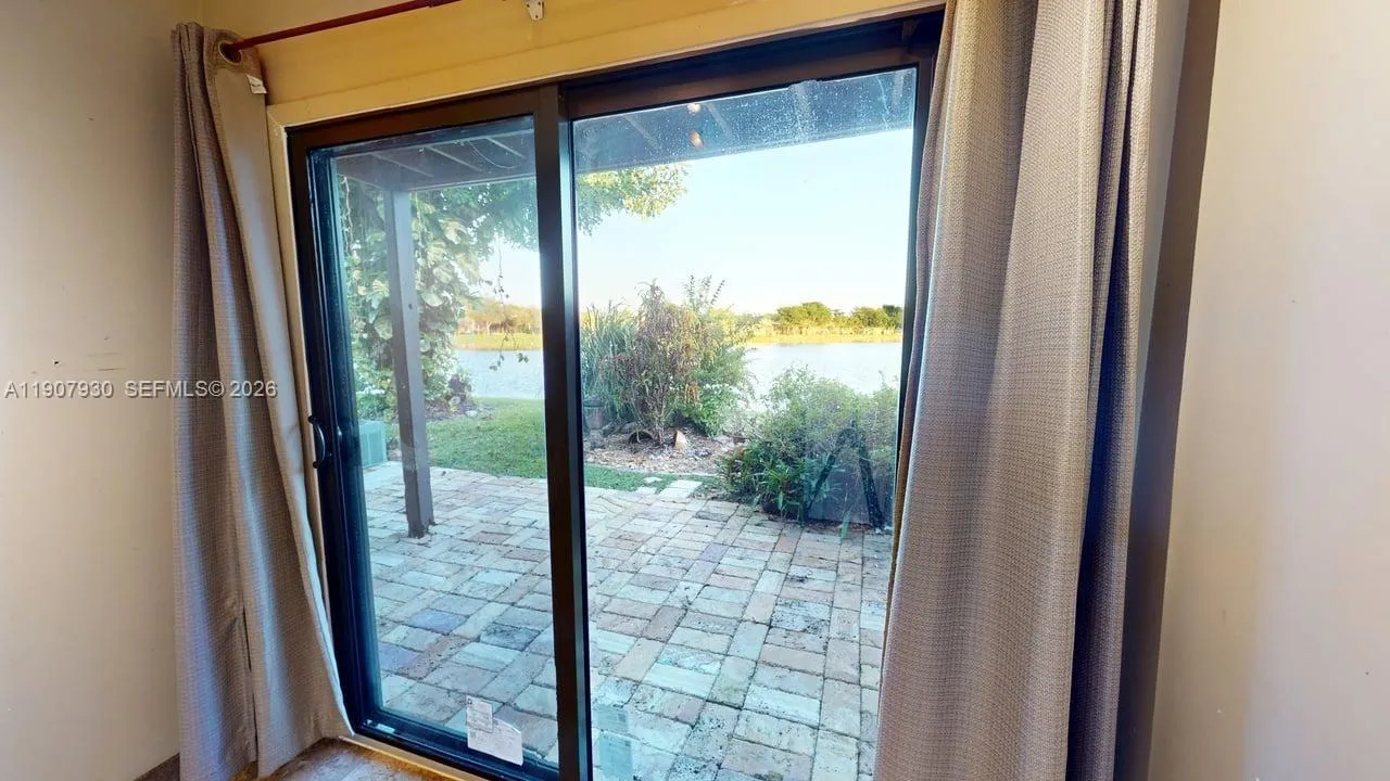 Private garden escape framed by lush landscaping perfect for outdoor relaxation, morning yoga, or weekend barbecues.