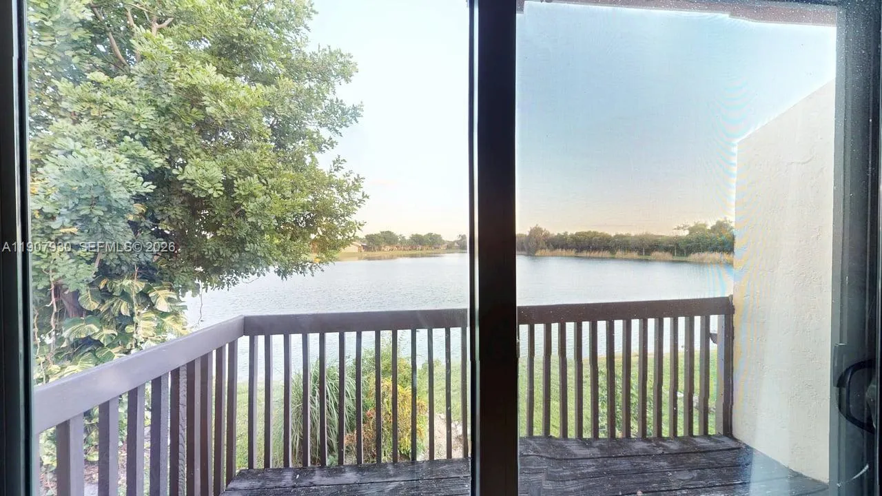 Private balcony overlooking Indian Lake a serene retreat to enjoy your morning coffee, evening sunsets, or simply the calm breeze of waterfront living.