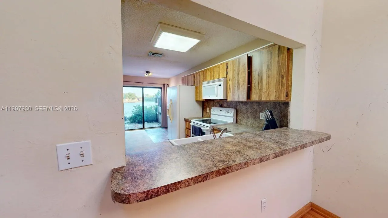 Stylish open wall shelf connecting the kitchen to the living area  perfect for serving, entertaining, or keeping conversation flowing while you cook.