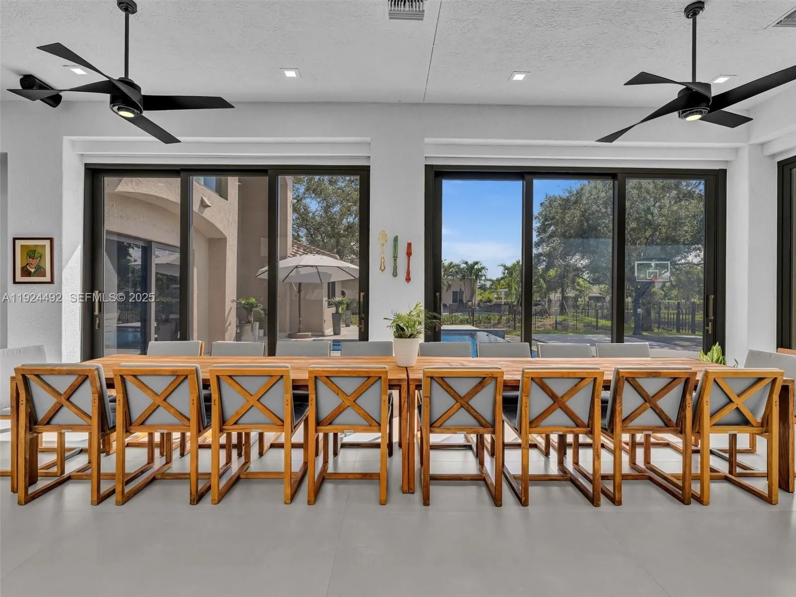 Indoor-outdoor Patio under AC with professional BBQ and room for extra large table, games etc.