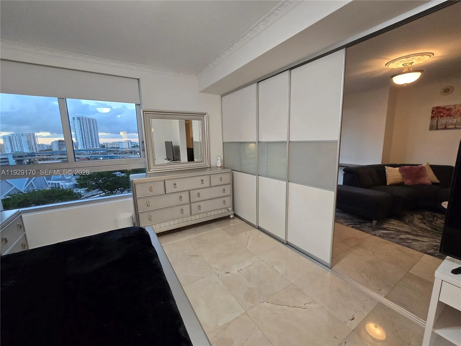 Bedroom can be made completely independent by closing modern frosted sliding doors (shown partially opened on this picture), fully closed and independet/private, or completely opened for full open layout.