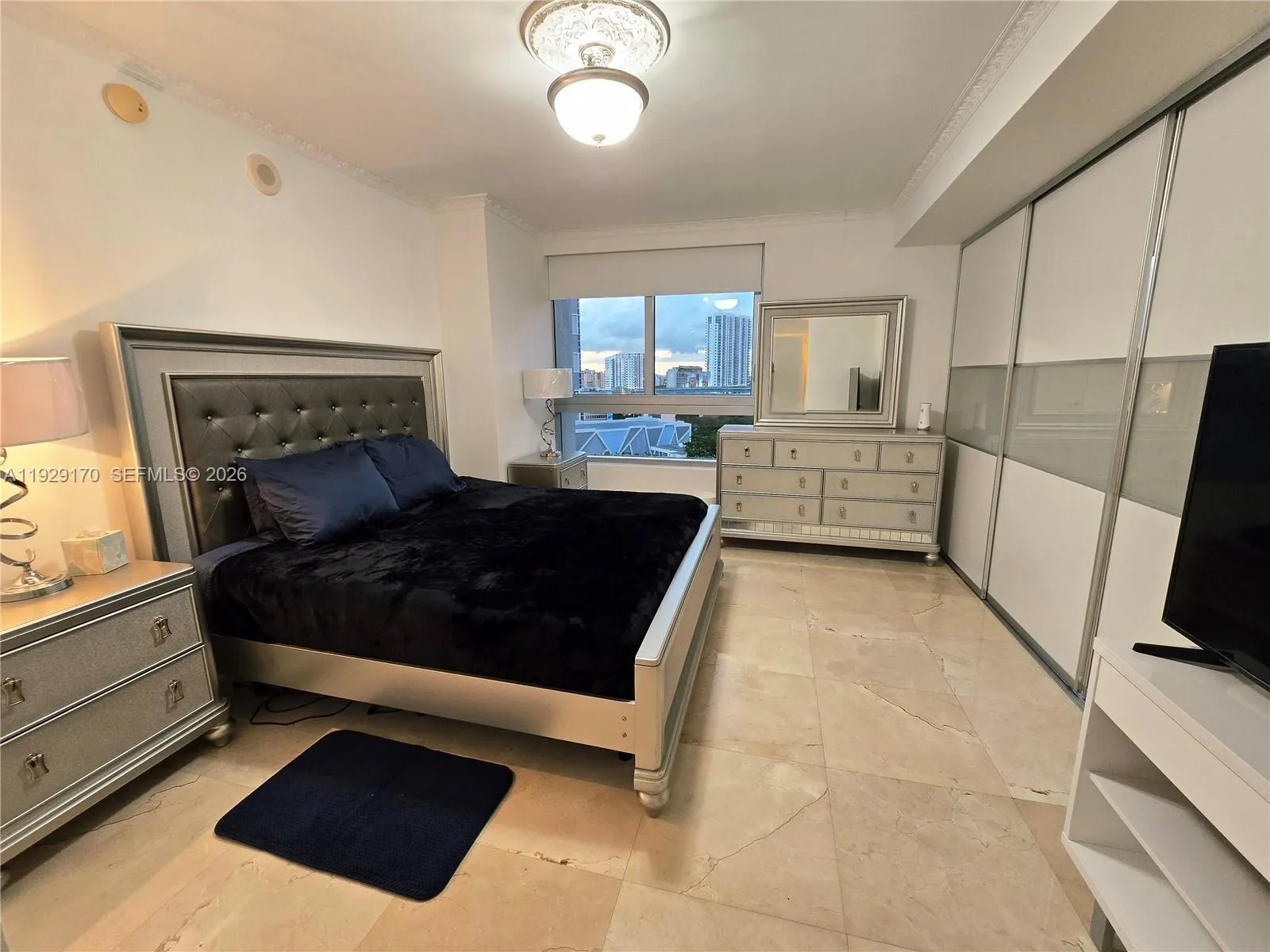 Bedroom can be made completely independent by closing modern frosted sliding doors (shown closed on this picture), partially, or completely opened for full open layout.