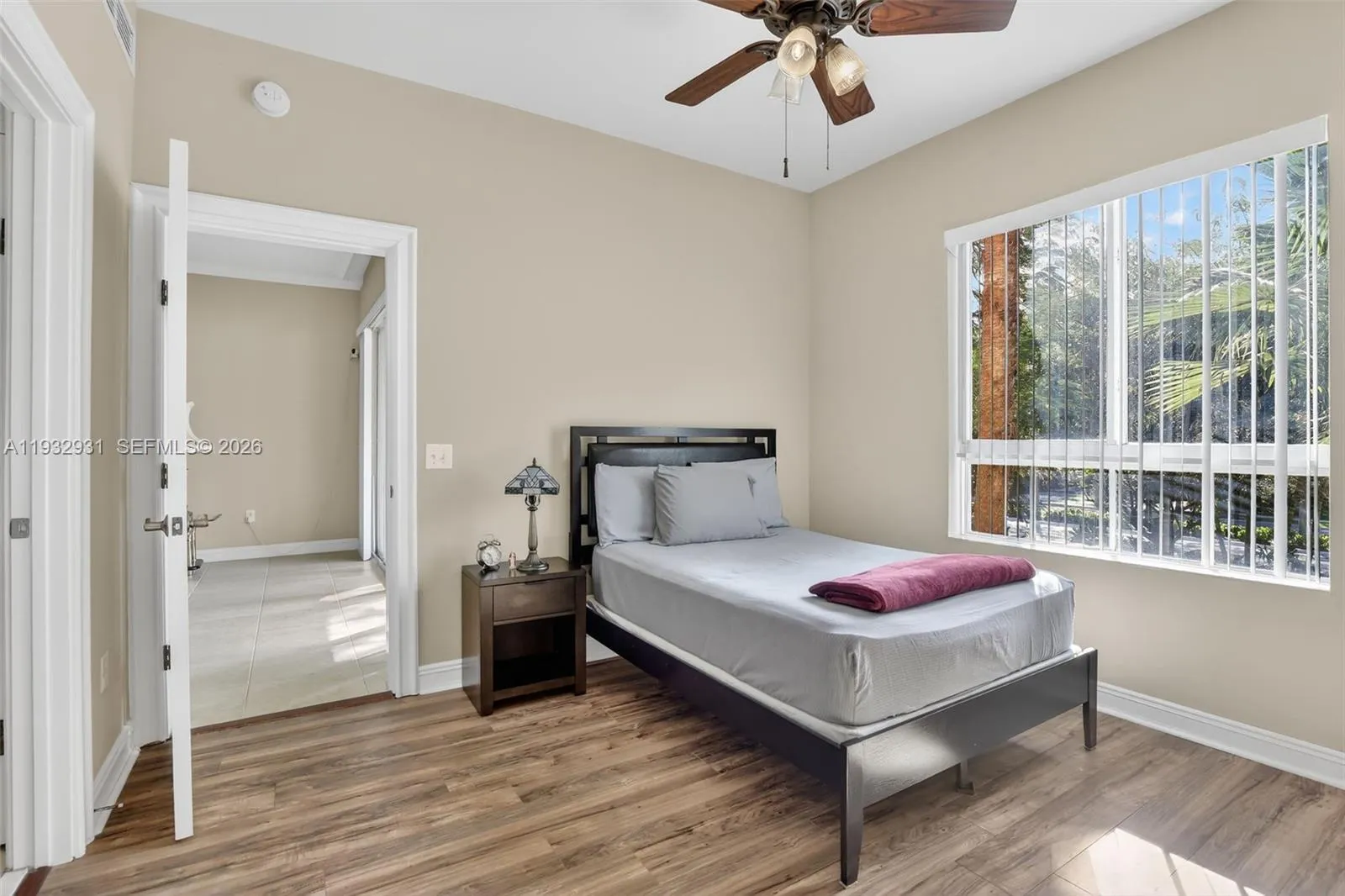 Bedroom boasts natural lighting and beautiful flooring.