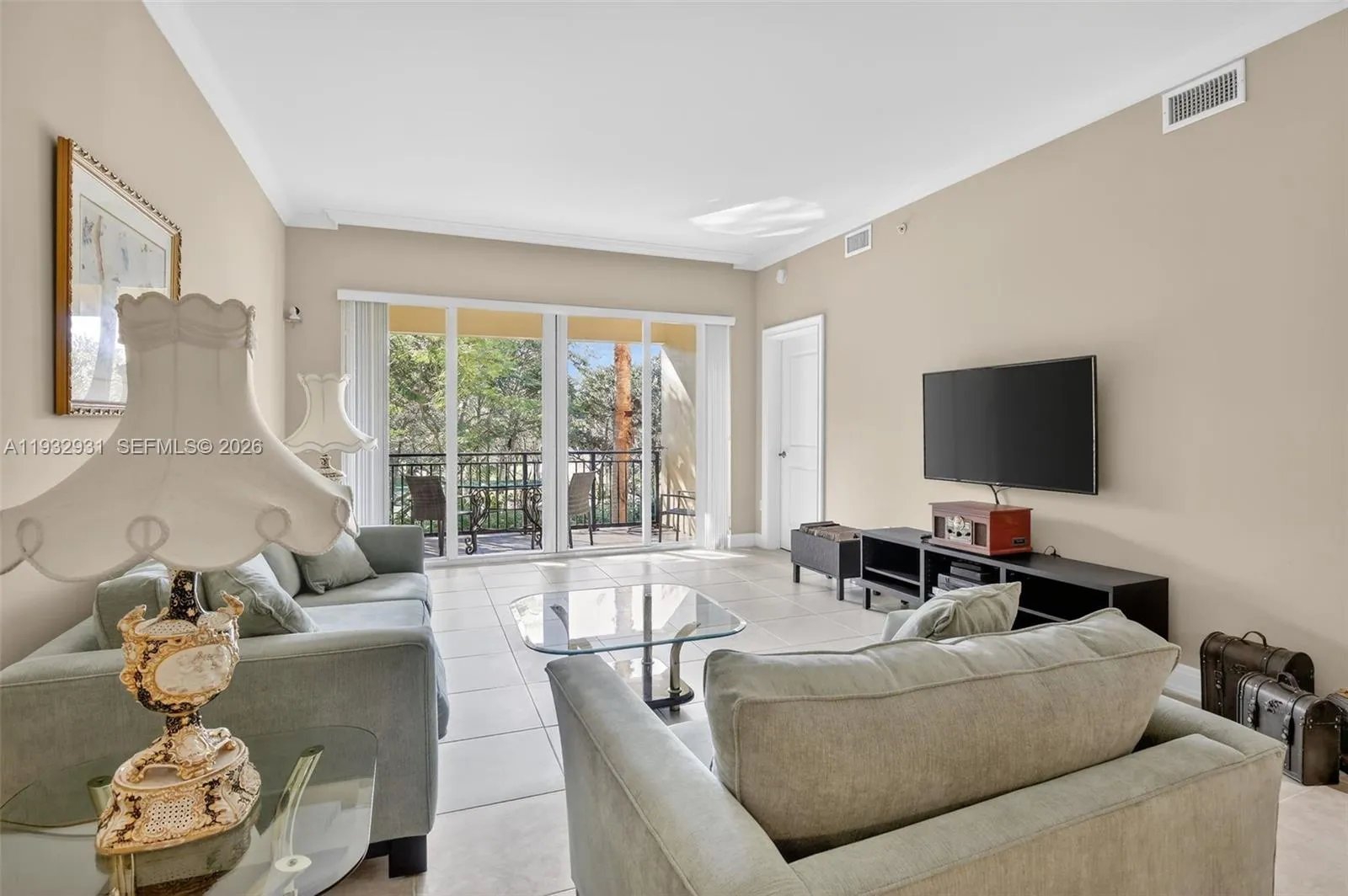 Warm, comfortable living room is dominated by ample natural light.