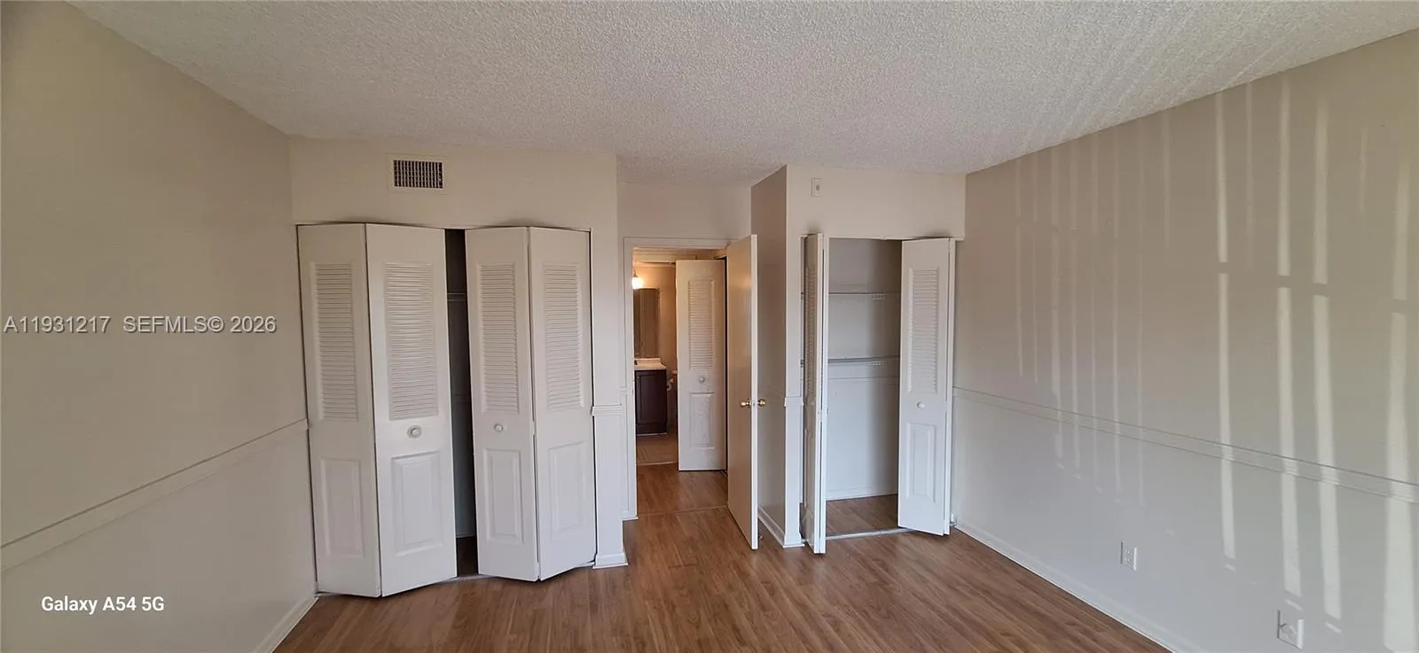 This room will hold a king bed but a queen will allow more space.