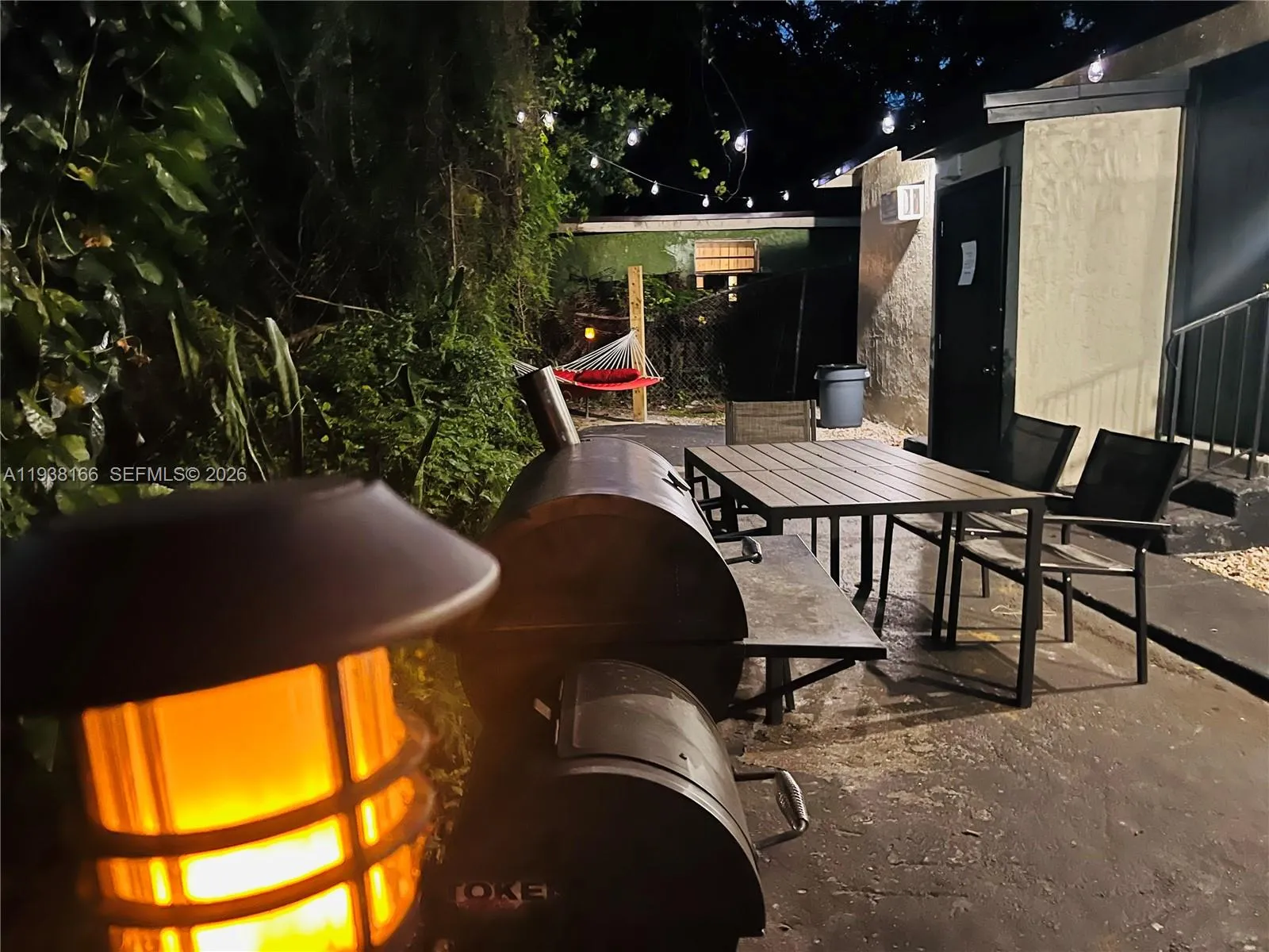 Night time view of entertainment area around back.