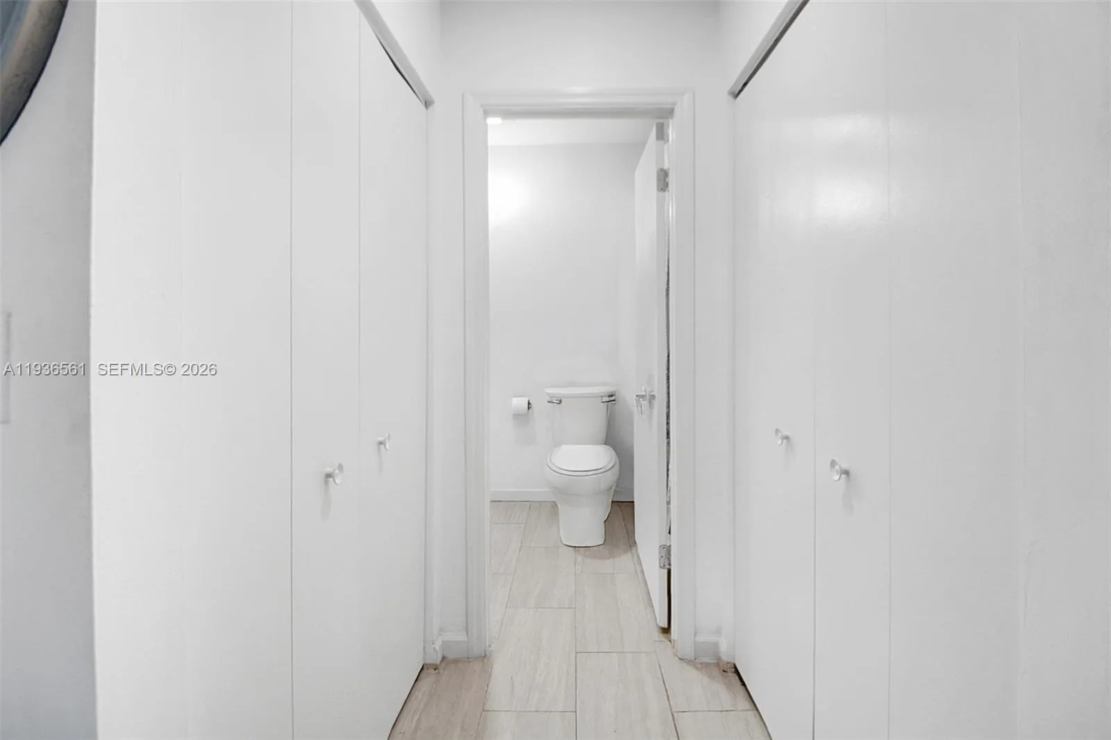 Closets and bathroom of primary suite.