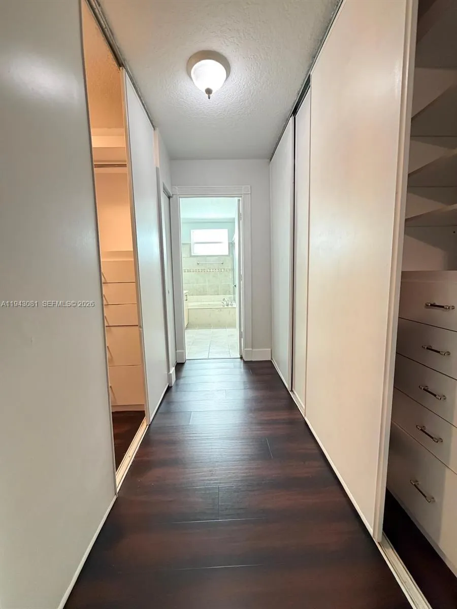 Hallway with closets into the master bathroom