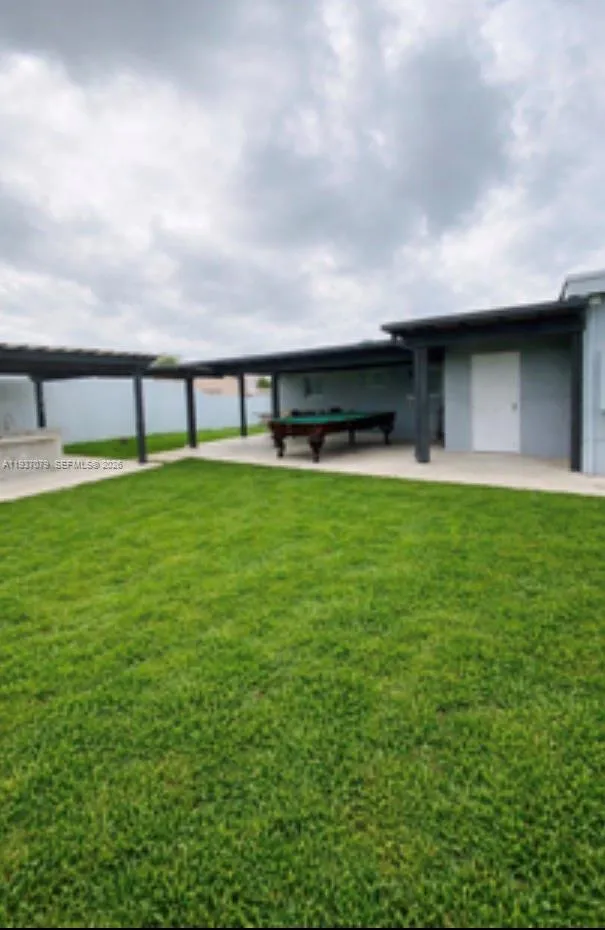 Back yard Lanai and out door kitchen .