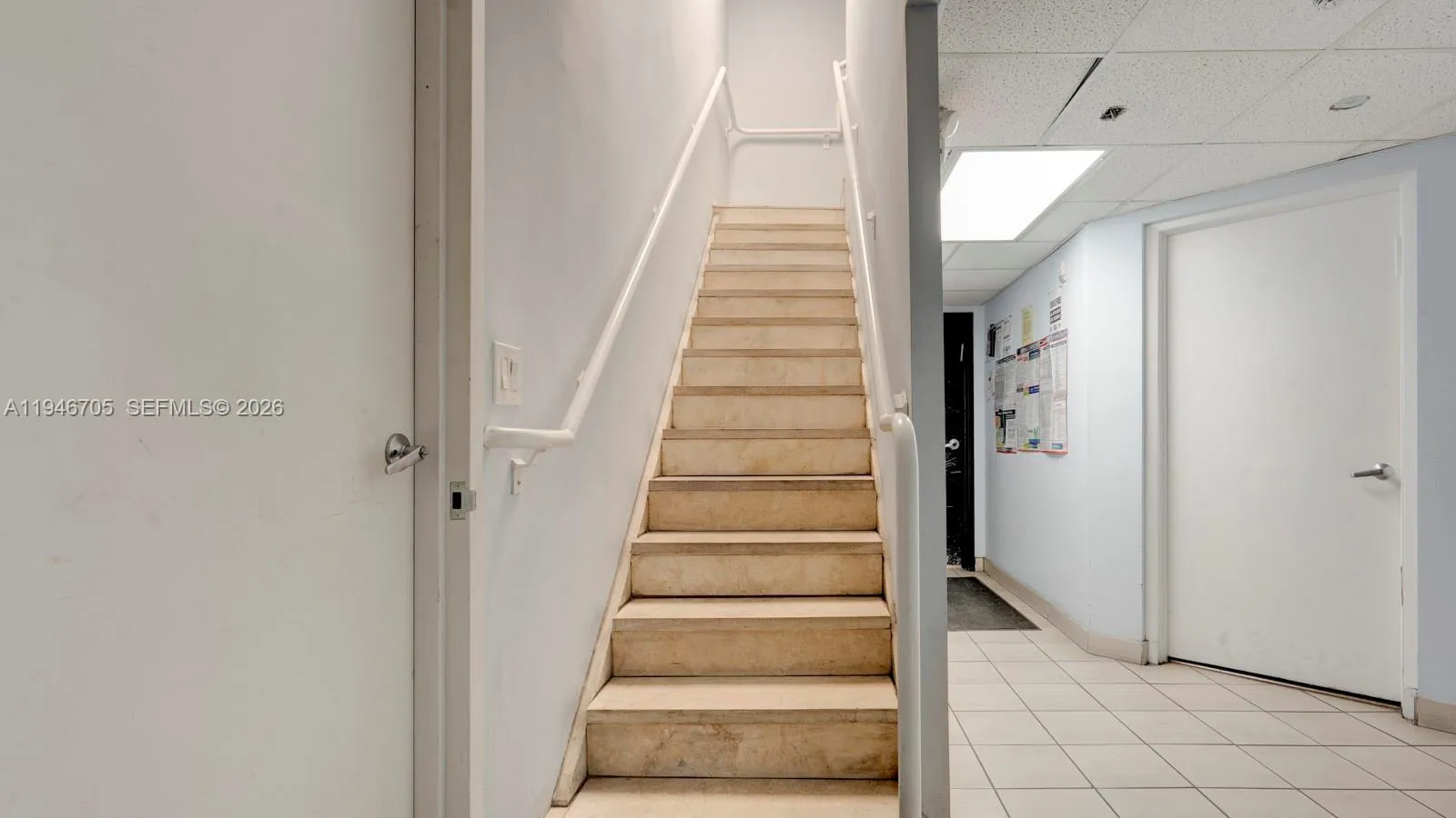 stairs connecting upstairs office to warehouse