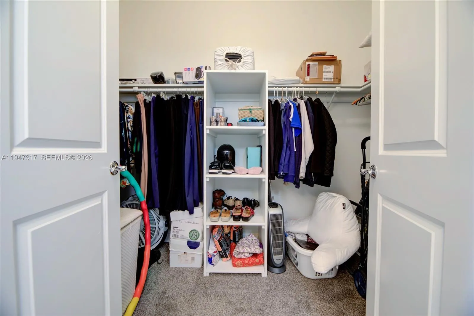 Spacious Primary Walk in closet with built-ins