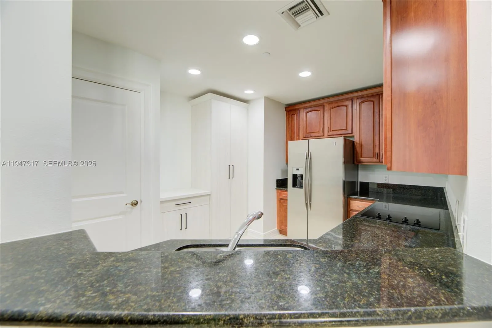 Custom Built-In Pantry and Laundry Storage