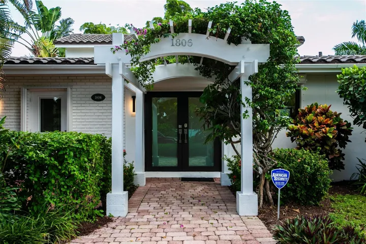 Trellis entry with impact French doors