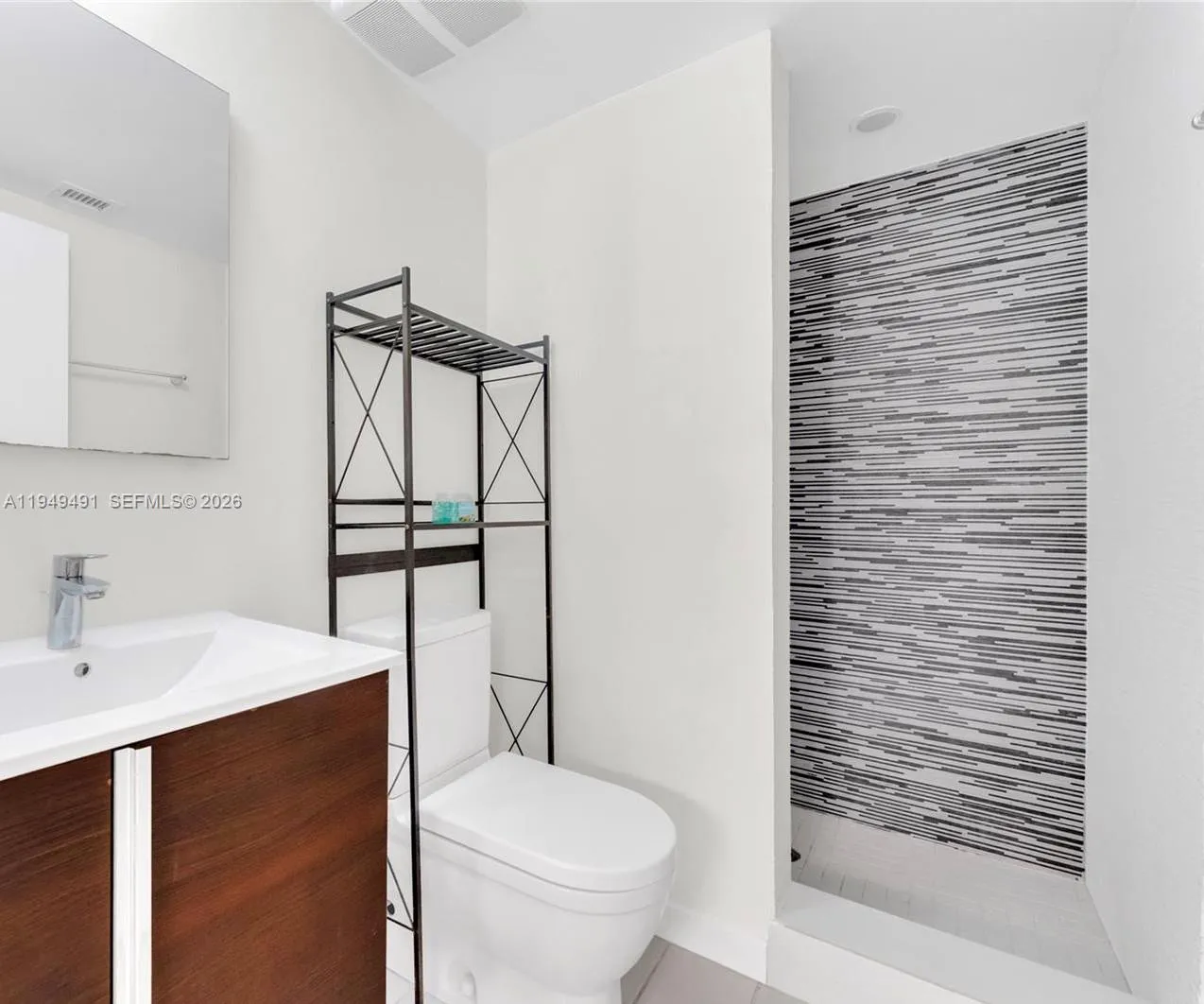 Contemporary bathroom with designer fixtures and a clean, modern aesthetic.