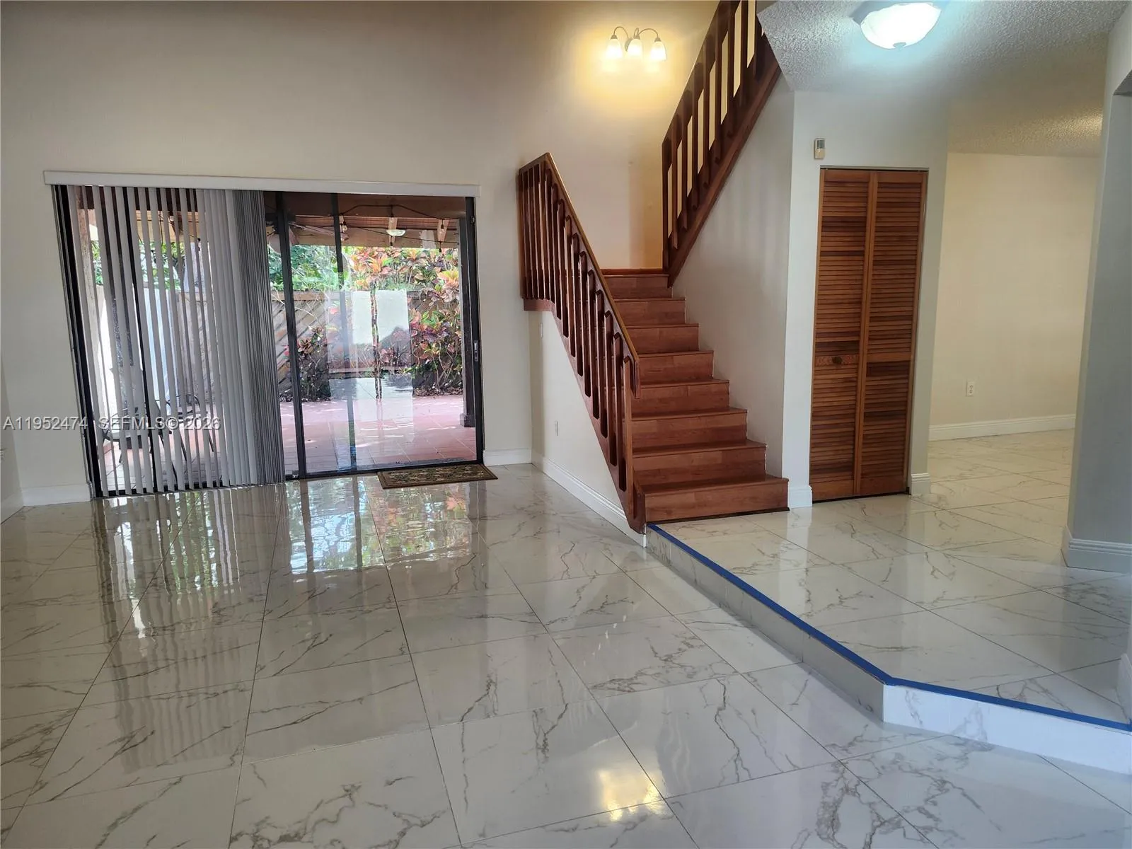 Living/Family Room with Staircase Leading to ALL Bedrooms.