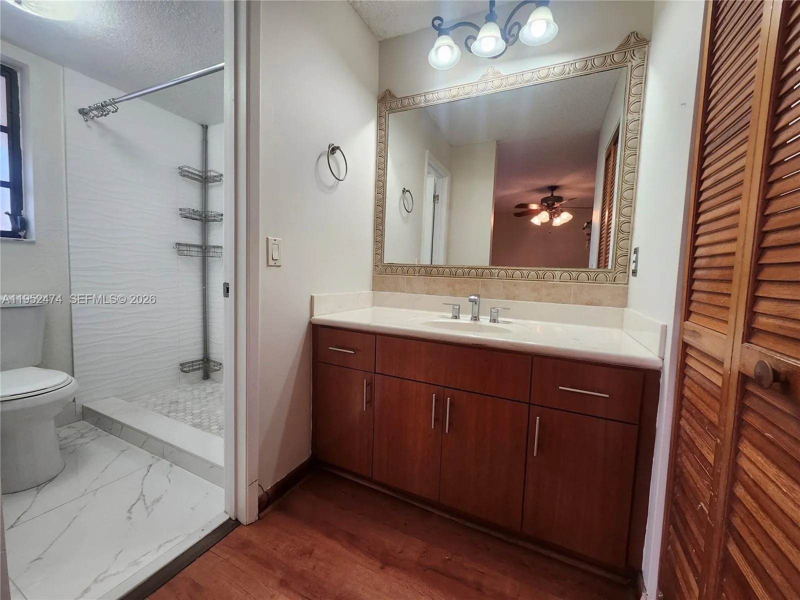 Primary Bathroom with Shower and Walk-in Closet on the Opposite Side.