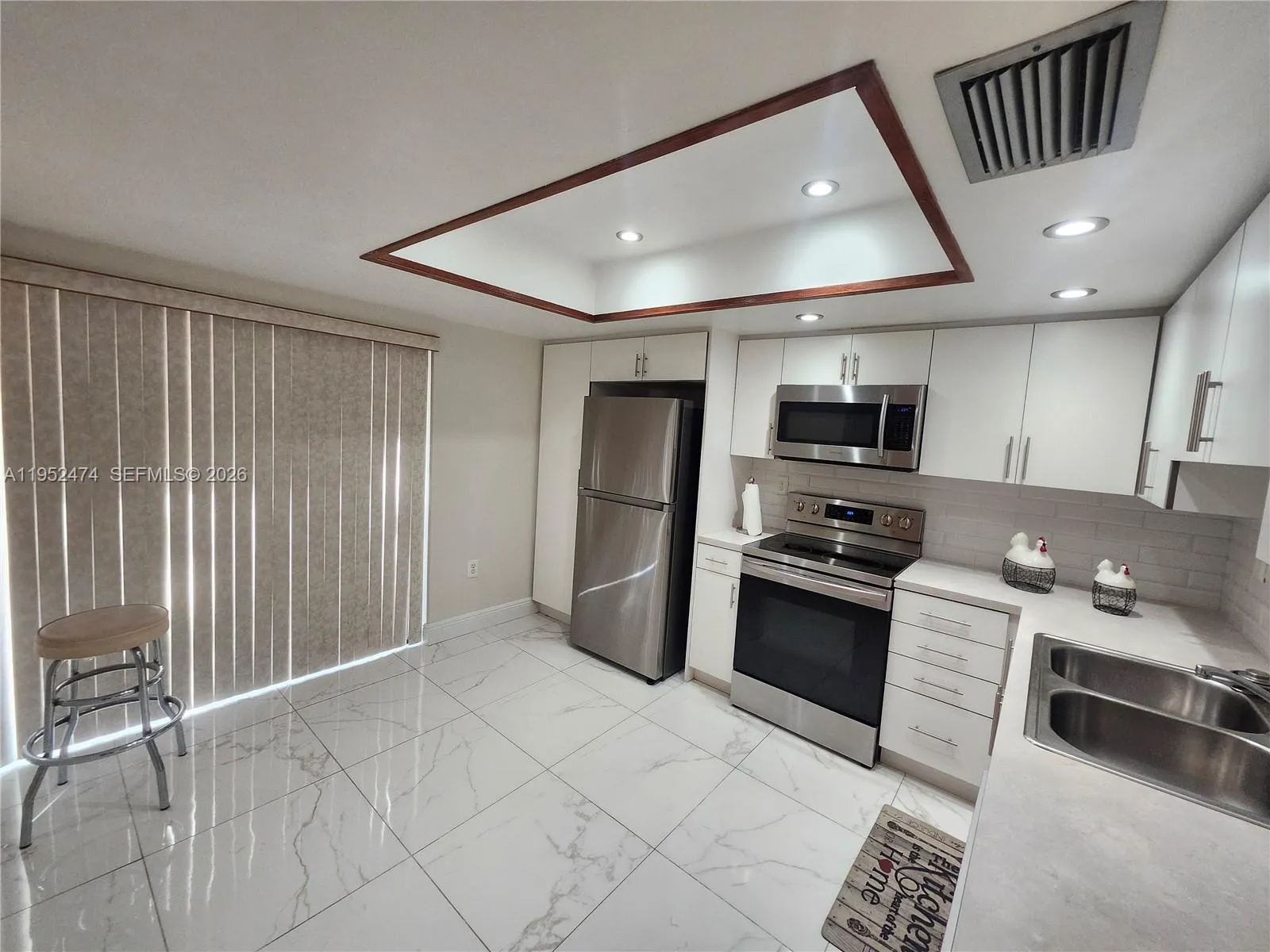 Eat-In Kitchen with Sliding Glass Doors Leading to the Back Patio.