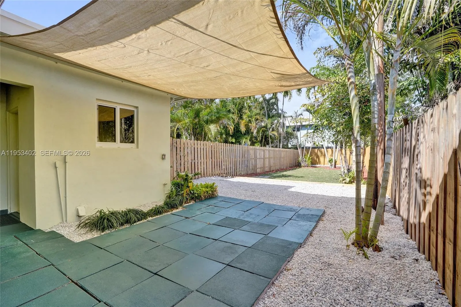 (1429) #2  -NEW sail, fresh stepping stones, new stone gravel. To the left, laundry with NEW water heater.
