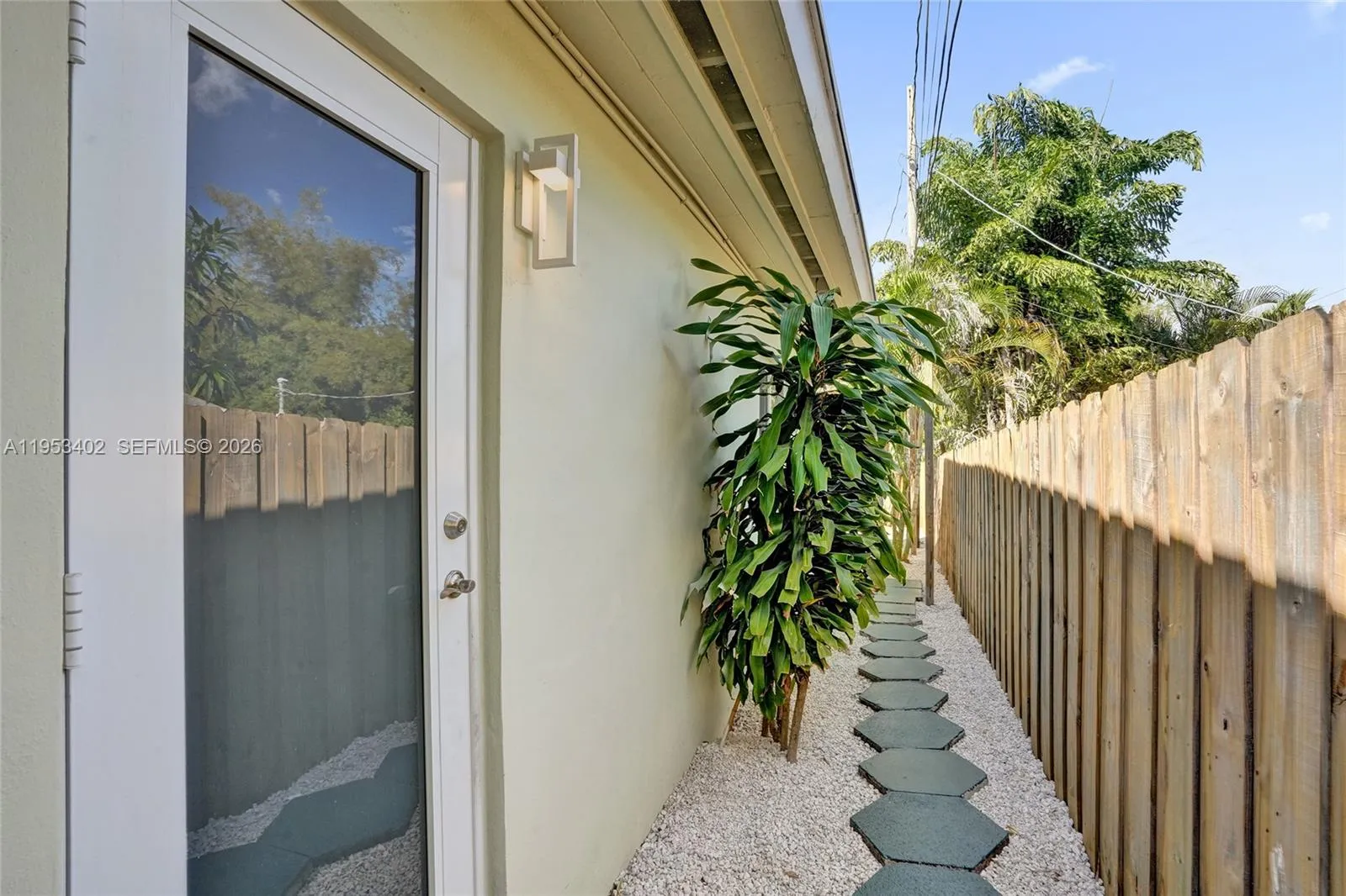 (1429) #2  -Side hurricane impact door by kitchen, behind private gate leading to the private enclosed back yard.