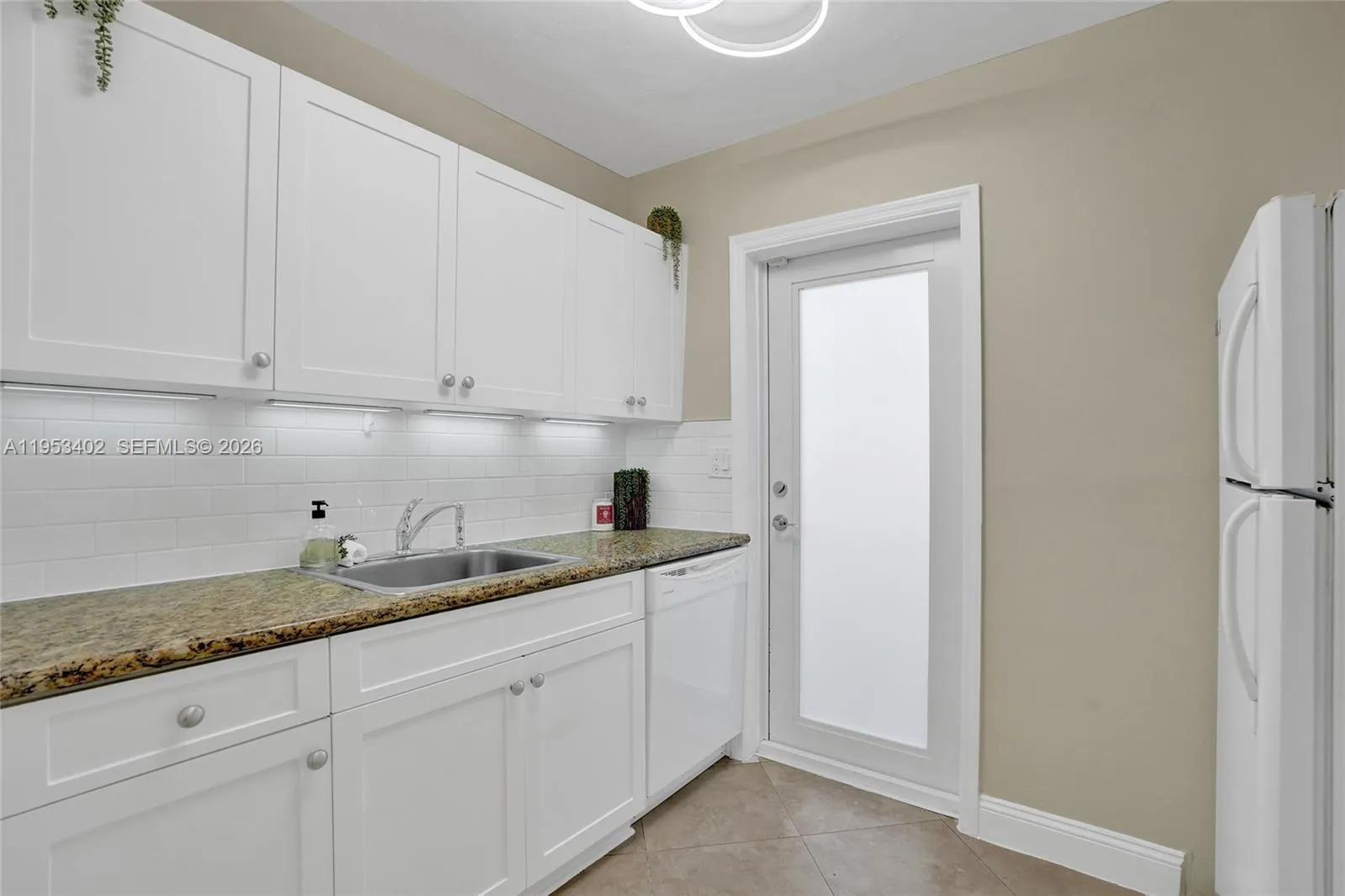 (1429) #2  -Hurricane impact door opens to private enclosed backyard. Door is behind private gate.