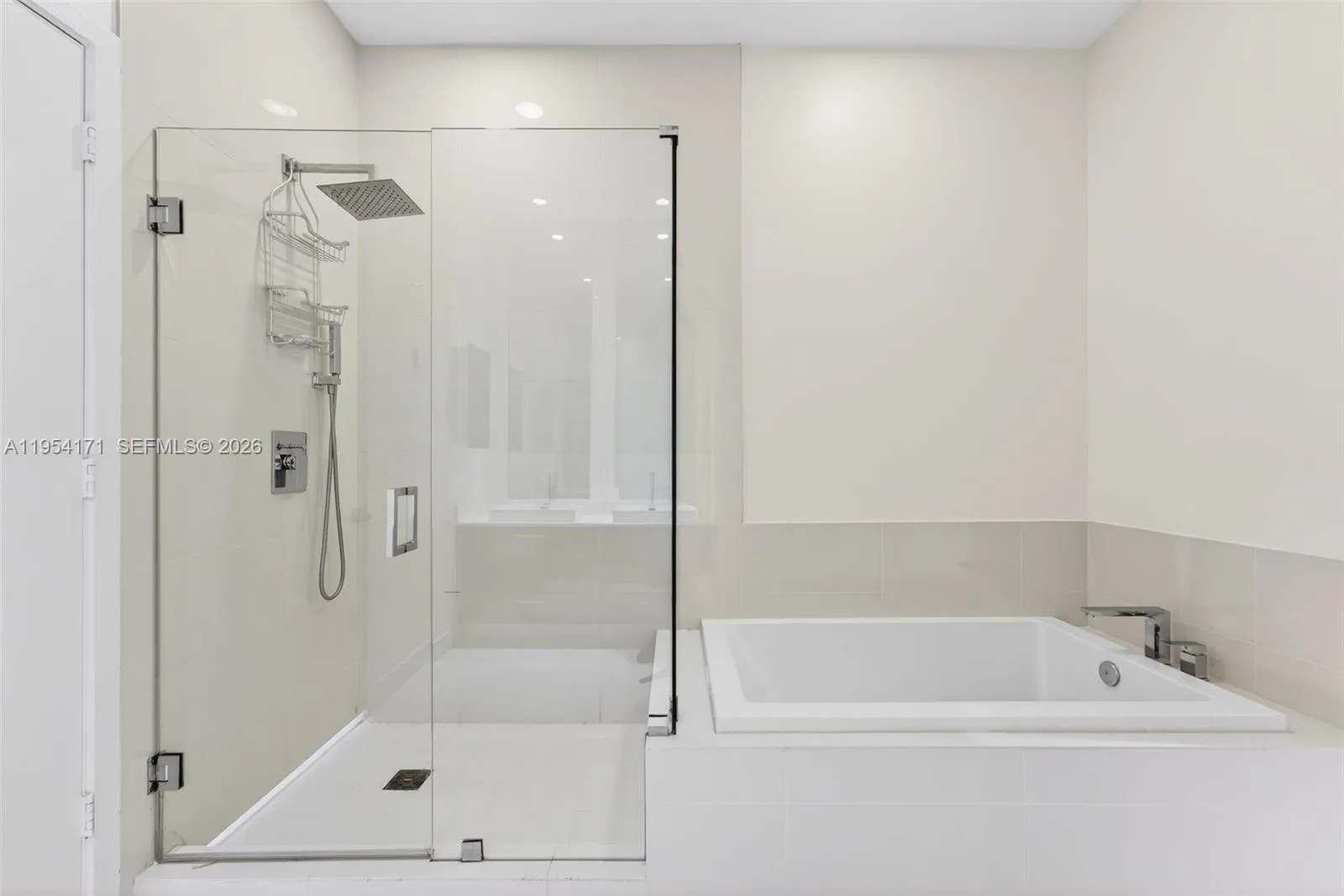 Primary En-Suite - separate shower and tub and separate lavatory room