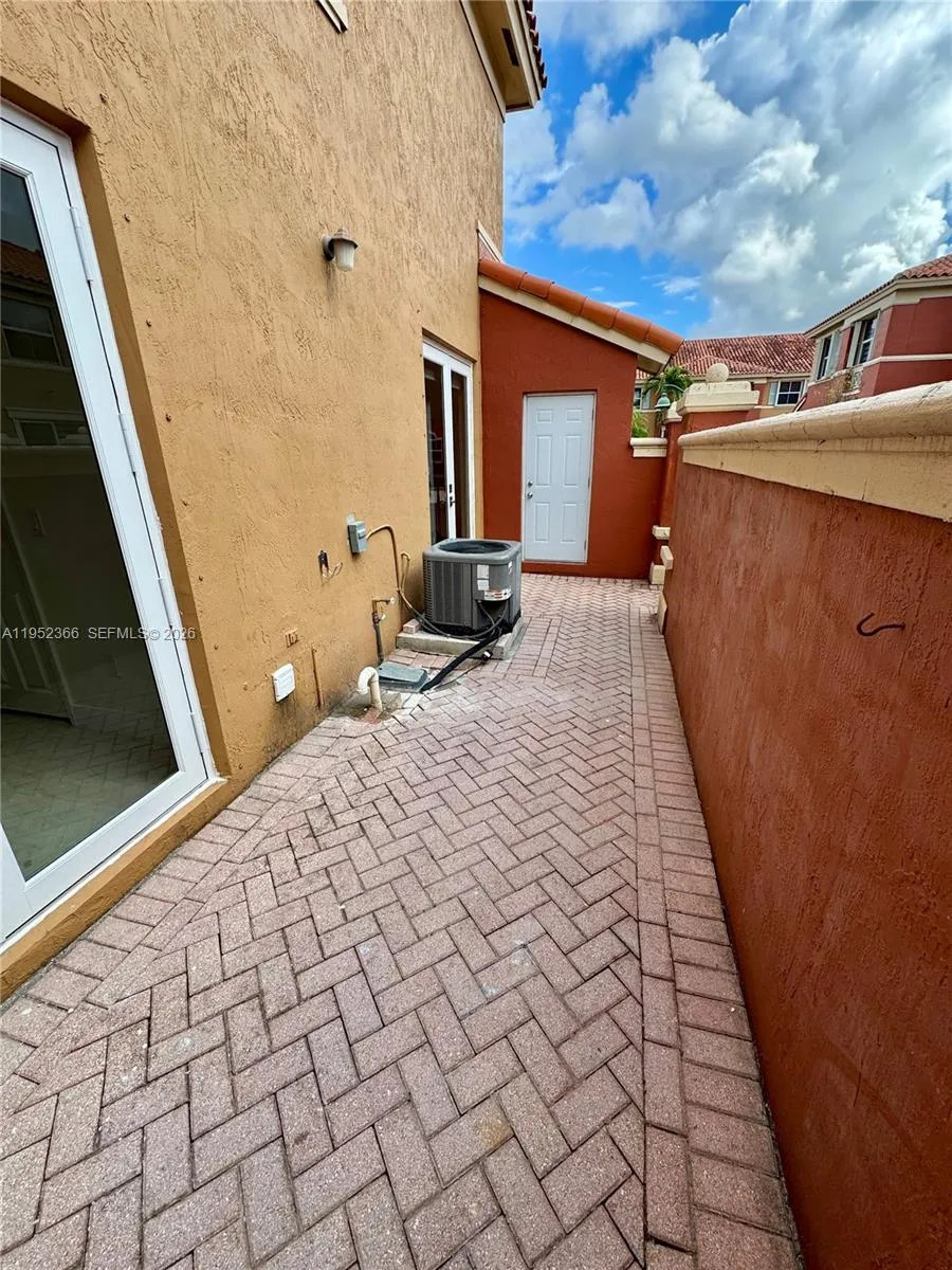 Side patio with storage room