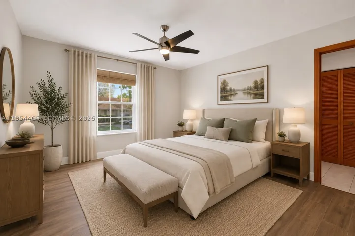 Image digitally enhanced with virtual staging - with a change of paint color and your own furnishings this could be your primary bedroom