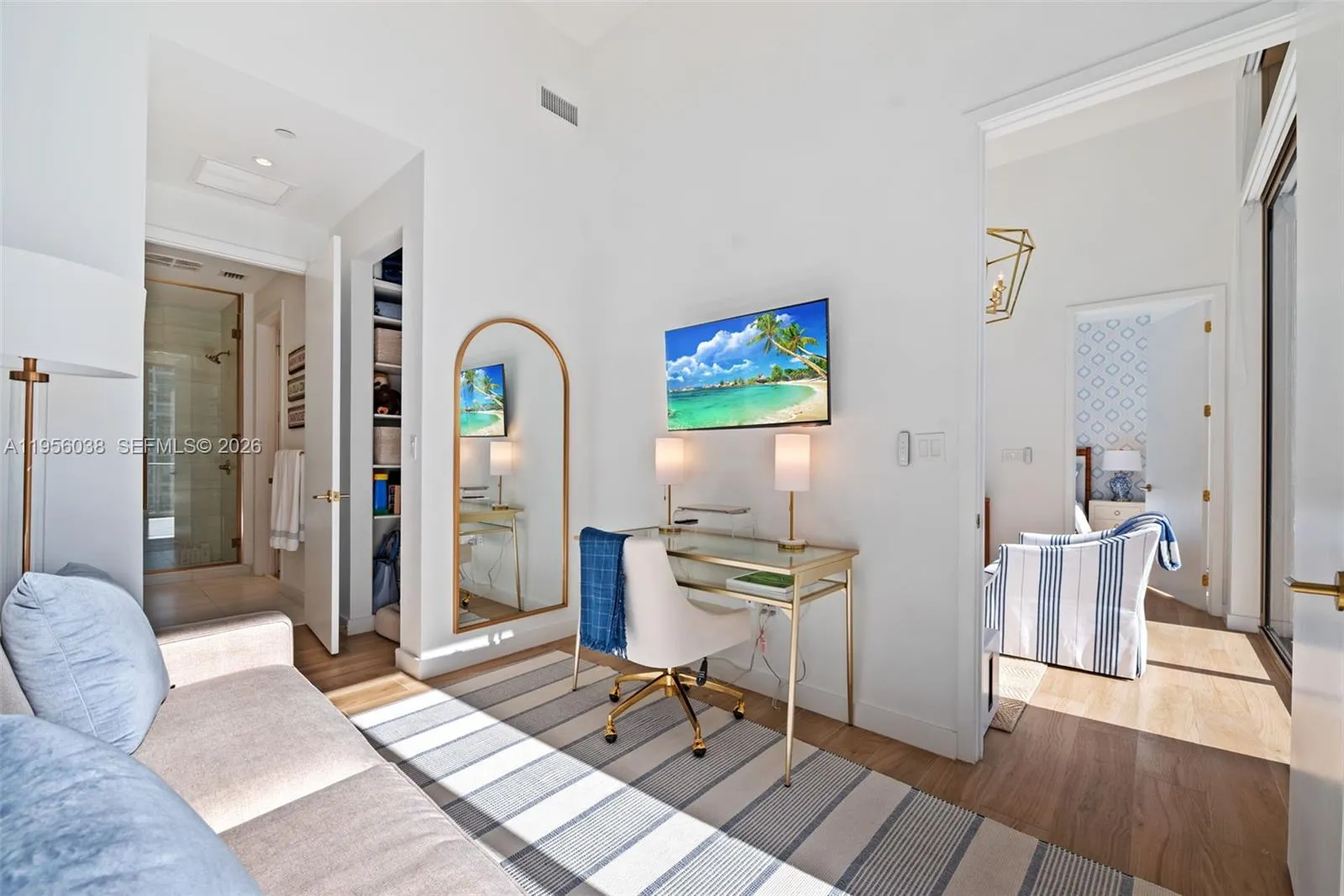 Versatile second bedroom ideal for guests, home office, or den, featuring oversized windows and contemporary finishes at Mr. C Coconut Grove.