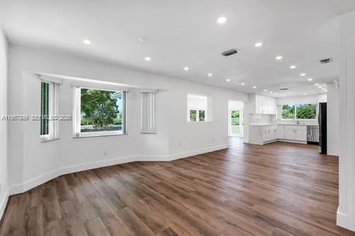 OPENS TO FORMAL LIVING UNSEEN AND FAMILY ROOM TO THE LEFT OF KITCHEN.. GREAT LAYOUT SET UP AS DESIRED.