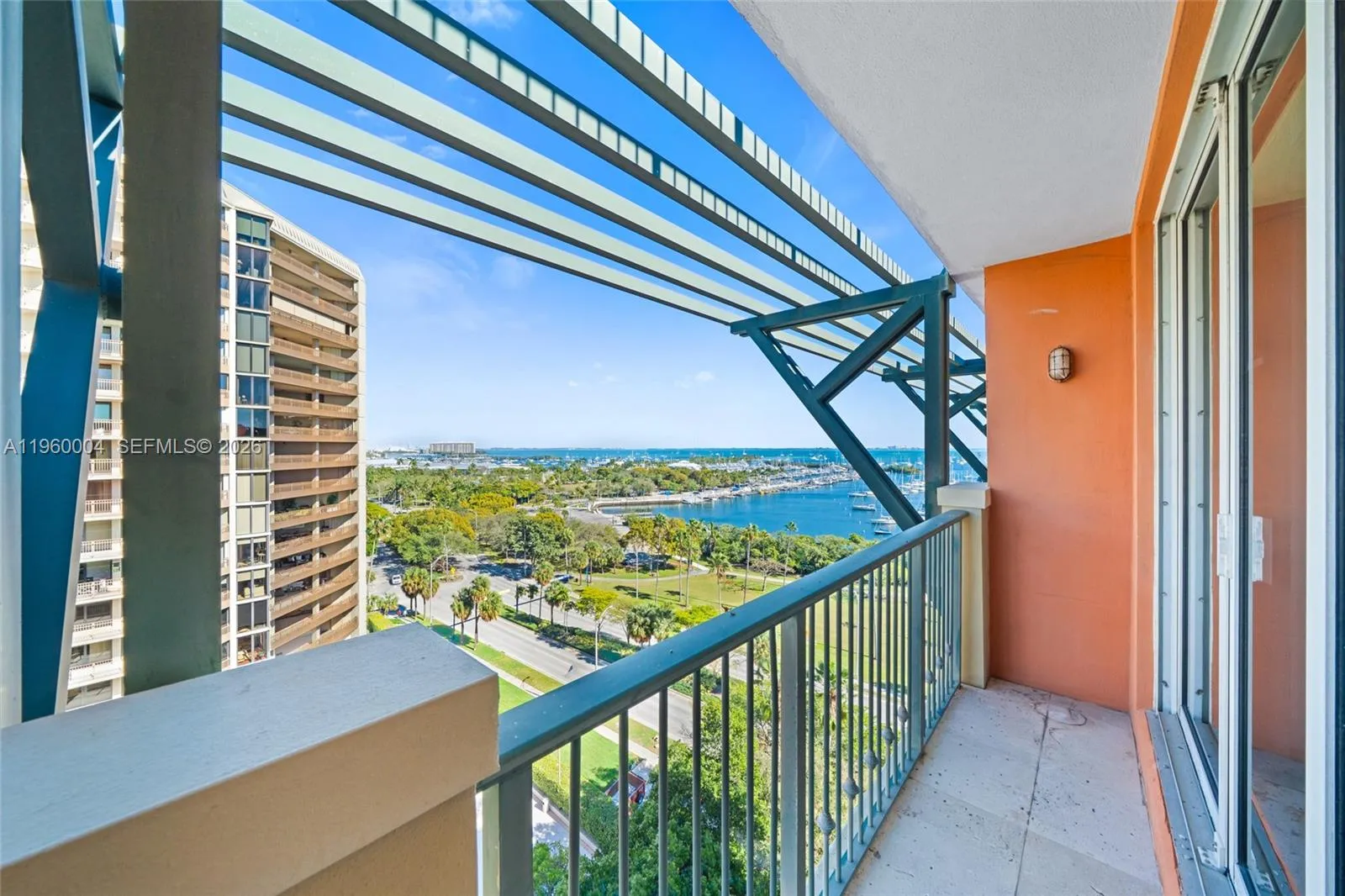 Balcony accessible from all rooms offers gorgeous views of Sailboat Bay and Myers Bayside Park