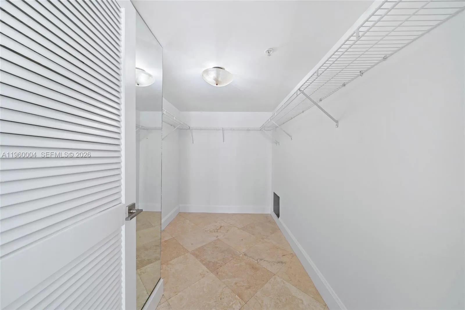 Primary bedroom features a walk-in closet