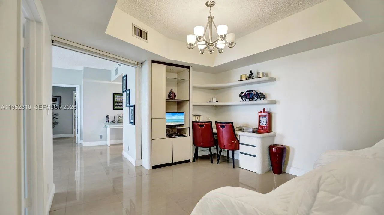 Den, office or formal dinning room.