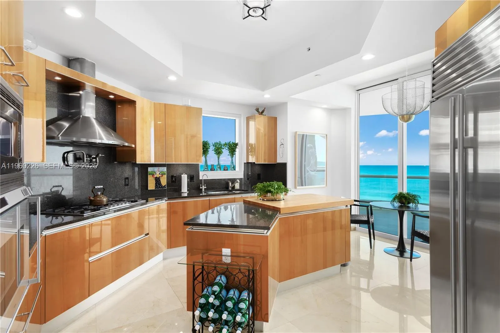 Huge kitchen with windows filled with ocean views.