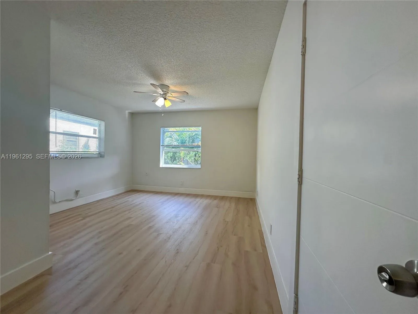 Large bedroom that can accommodate king size bedding.