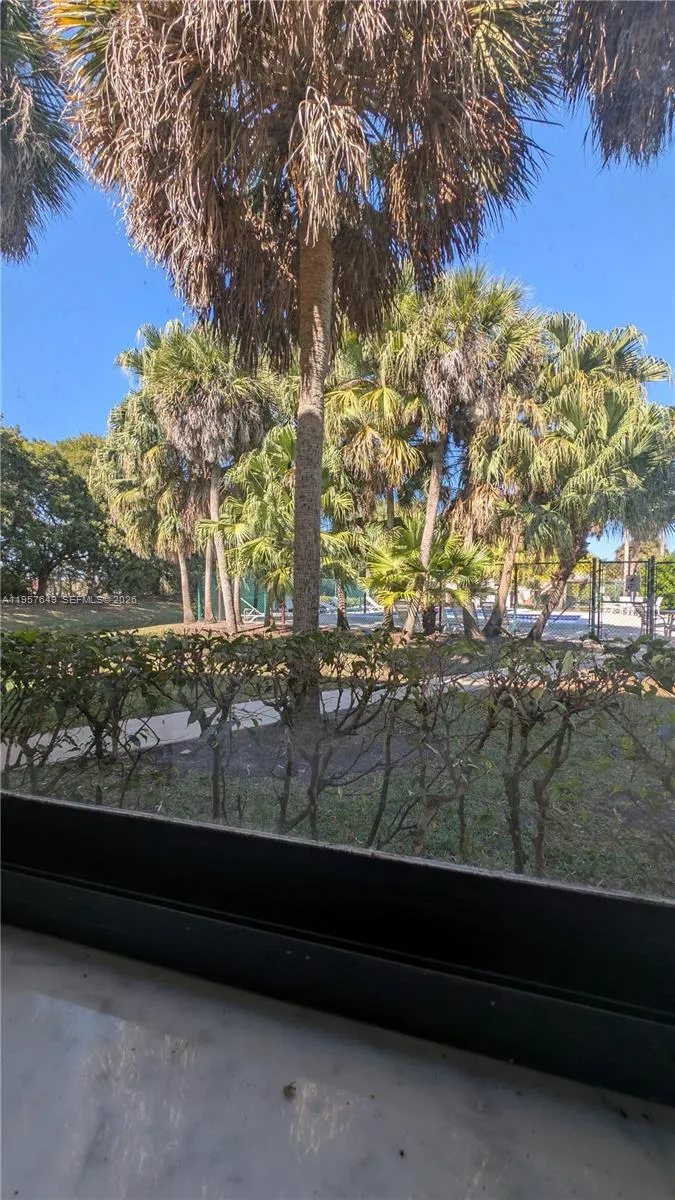 View from primary bedroom window facing the pool