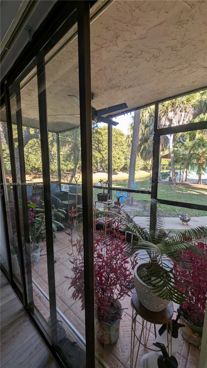 View from family room sliding doors, facing pool and the canal