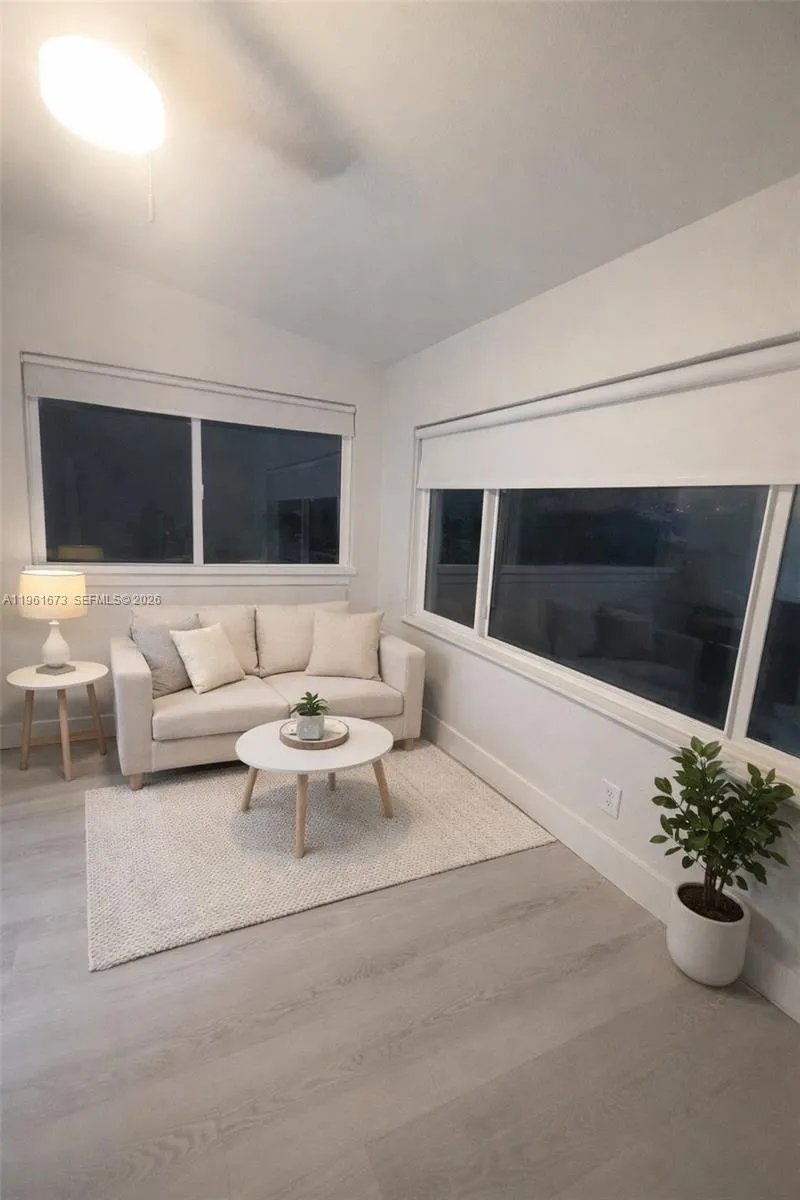 Entrance with french doors to familyroom.Can be used as flex or den. Used now as storage.