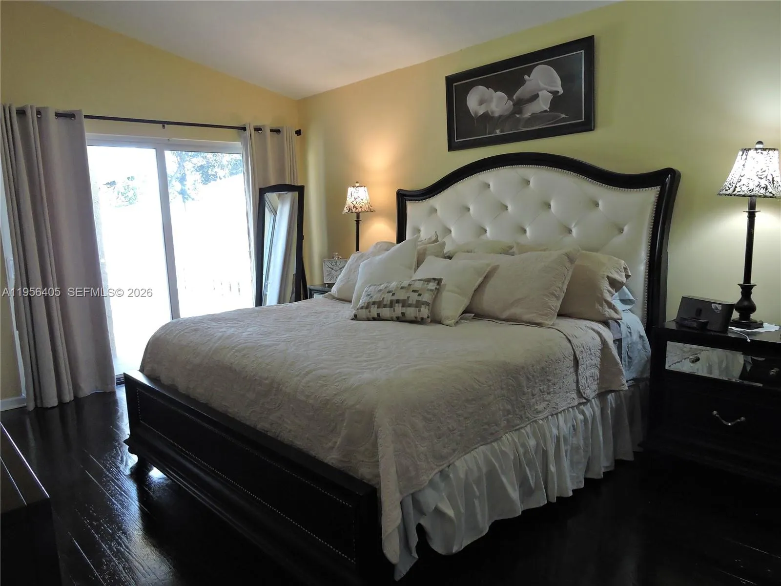 master bedroom with access to pool/patio